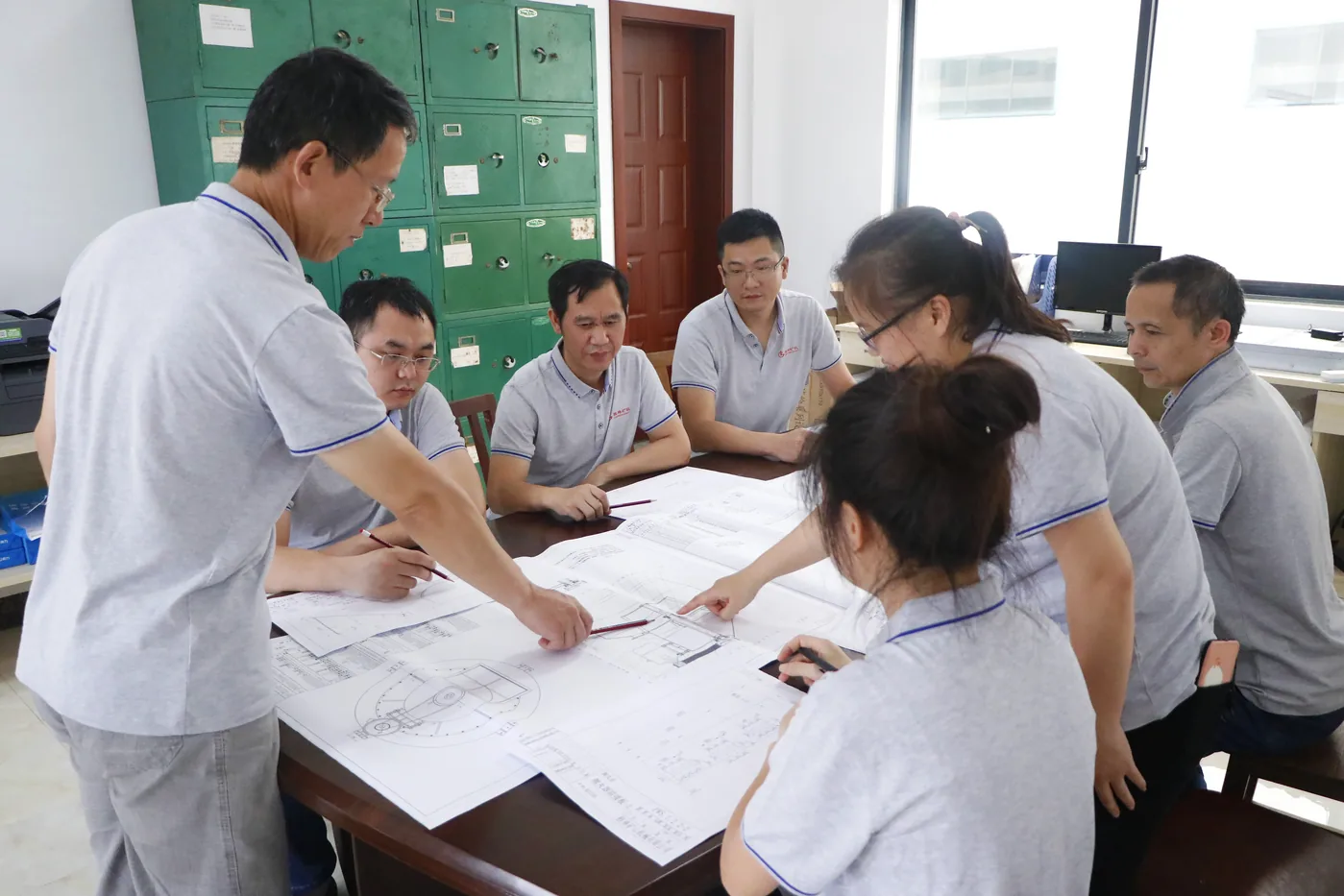 Cronus engineering team reviewing grinding mill designs